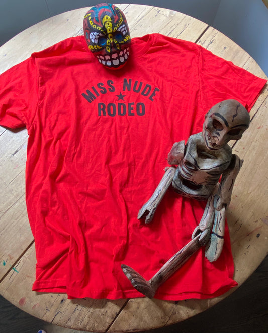 red tee with Miss Nude Rodeo logo